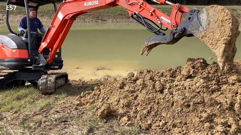 digging a pond with a mini excavator|digging pond with mini excavator.